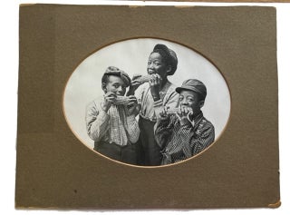 Item #75617 Three African American Boys Pretending to Eat Corn on the Cob. [our title]. Photograph