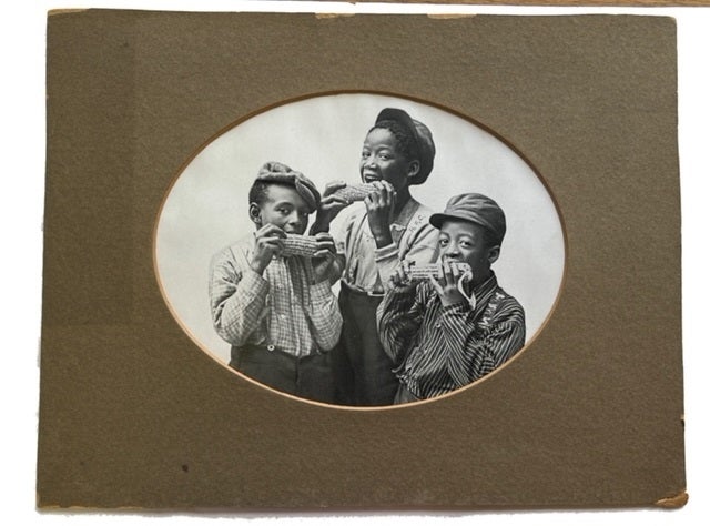 Item #75617 Three African American Boys Pretending to Eat Corn on the Cob. [our title]. Photograph.
