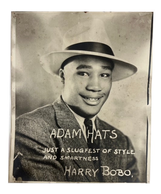 Item #90295 Adam Hats: Just a Slugfest of Style and Smartness Harry Bobo. Harry Bobo, Photograph.