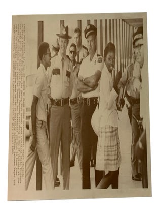 Item #93522 Going to Class under Guard. AP Wirephoto. Aug. 28, 1969. New Iberia, La. Photo of two...
