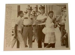 Item #93522 Going to Class under Guard. AP Wirephoto. Aug. 28, 1969. New Iberia, La. Photo of two...