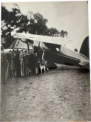 Four 1932 Amelia Earhart wire service photos in black and white accompanied by original descriptive text. All relate to her Solo Flight across the Atlantic Ocean to Europe