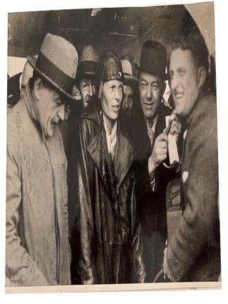 Four 1932 Amelia Earhart wire service photos in black and white accompanied by original descriptive text. All relate to her Solo Flight across the Atlantic Ocean to Europe